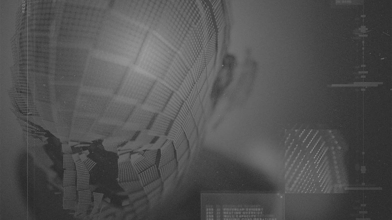 Greyscale top down view of a human head, wireframe-style, fragmented, with text elements