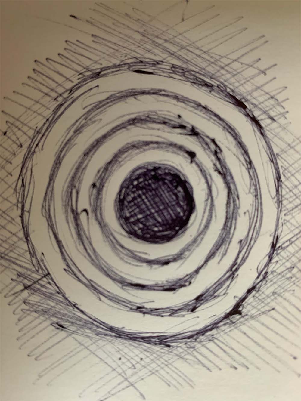 Sketch of a circle surrounded by concentric rings