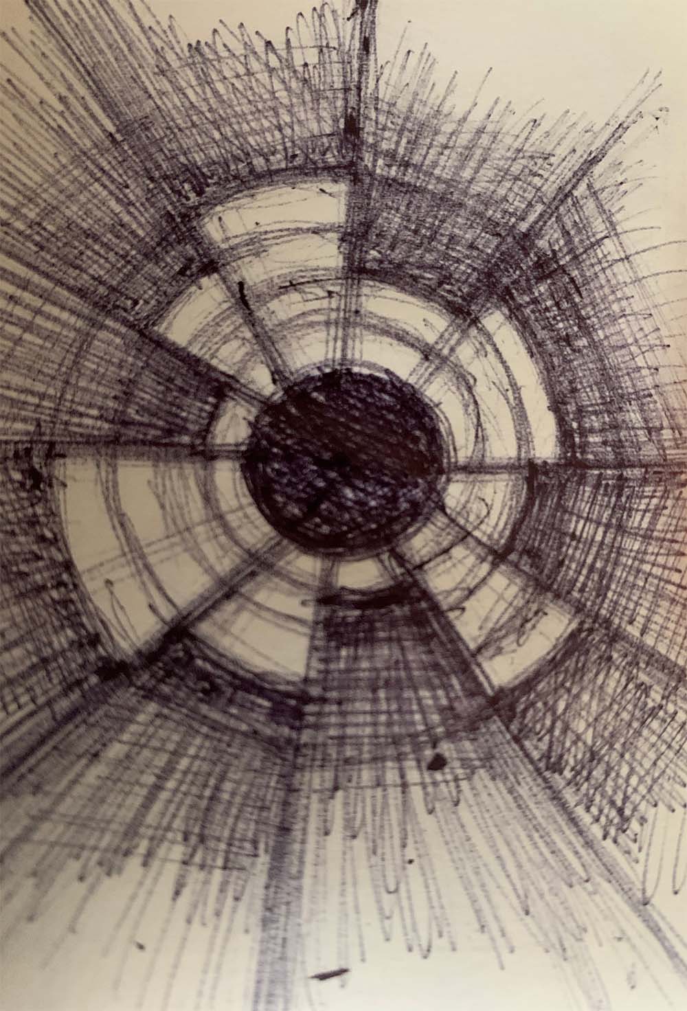 Sketch of a circle surrounded by concentric rings with slices removed